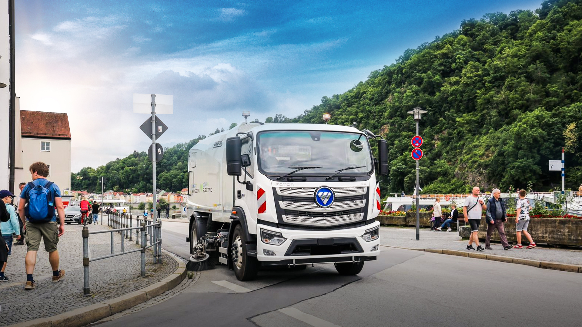 FOTON electric street-sweeper truck operating on a European riverside street
